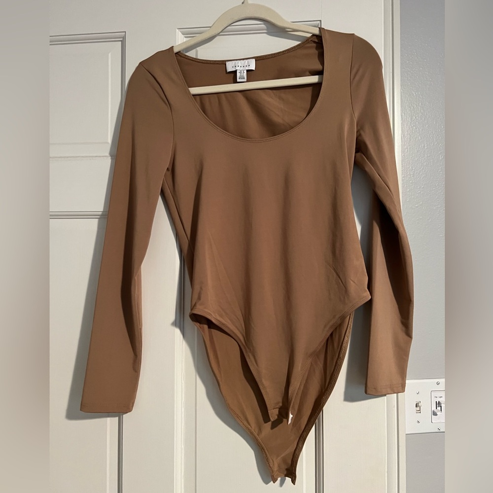 Nude Topshop long sleeve bodysuit.